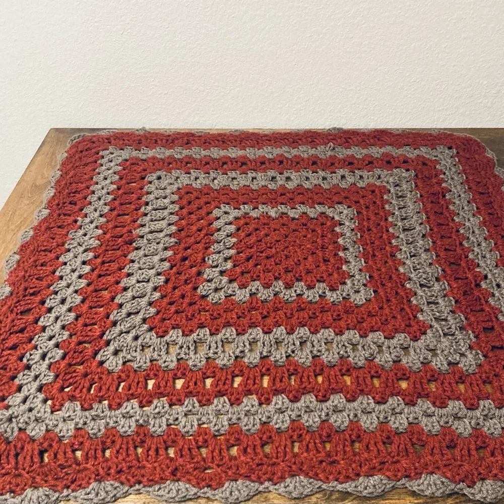 Vintage hand made retro burnt orange and grey knitted crochet granny table cover